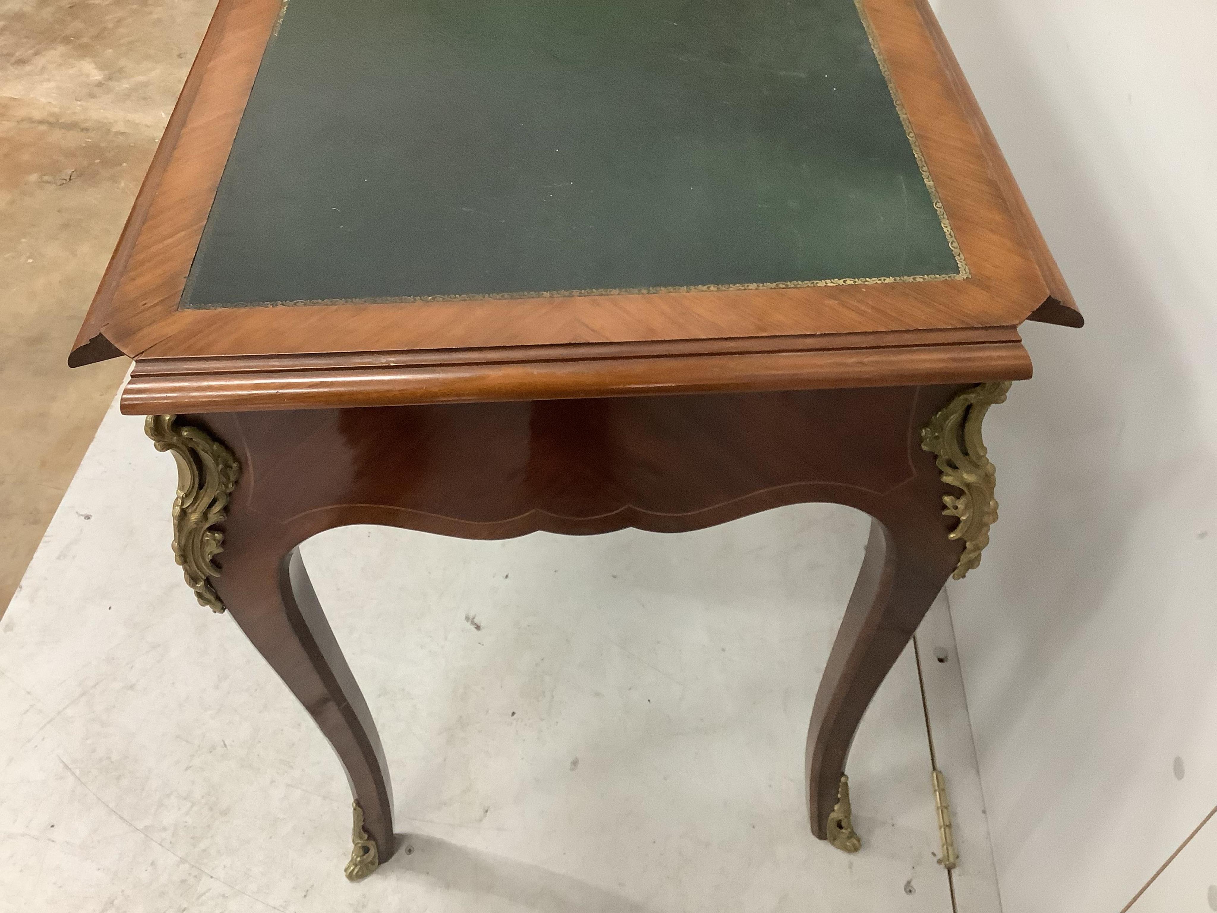 A French gilt metal mounted kingwood bureau plat, width 113cm, depth 60cm, height 77cm. Condition - fair, pieces of corner moulding are missing